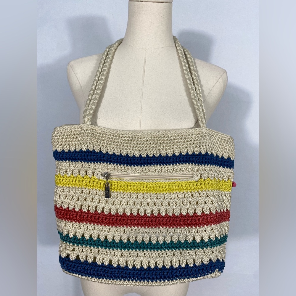 The Sak crocheted striped shoulder bag with pink pom-poms Casual Classics